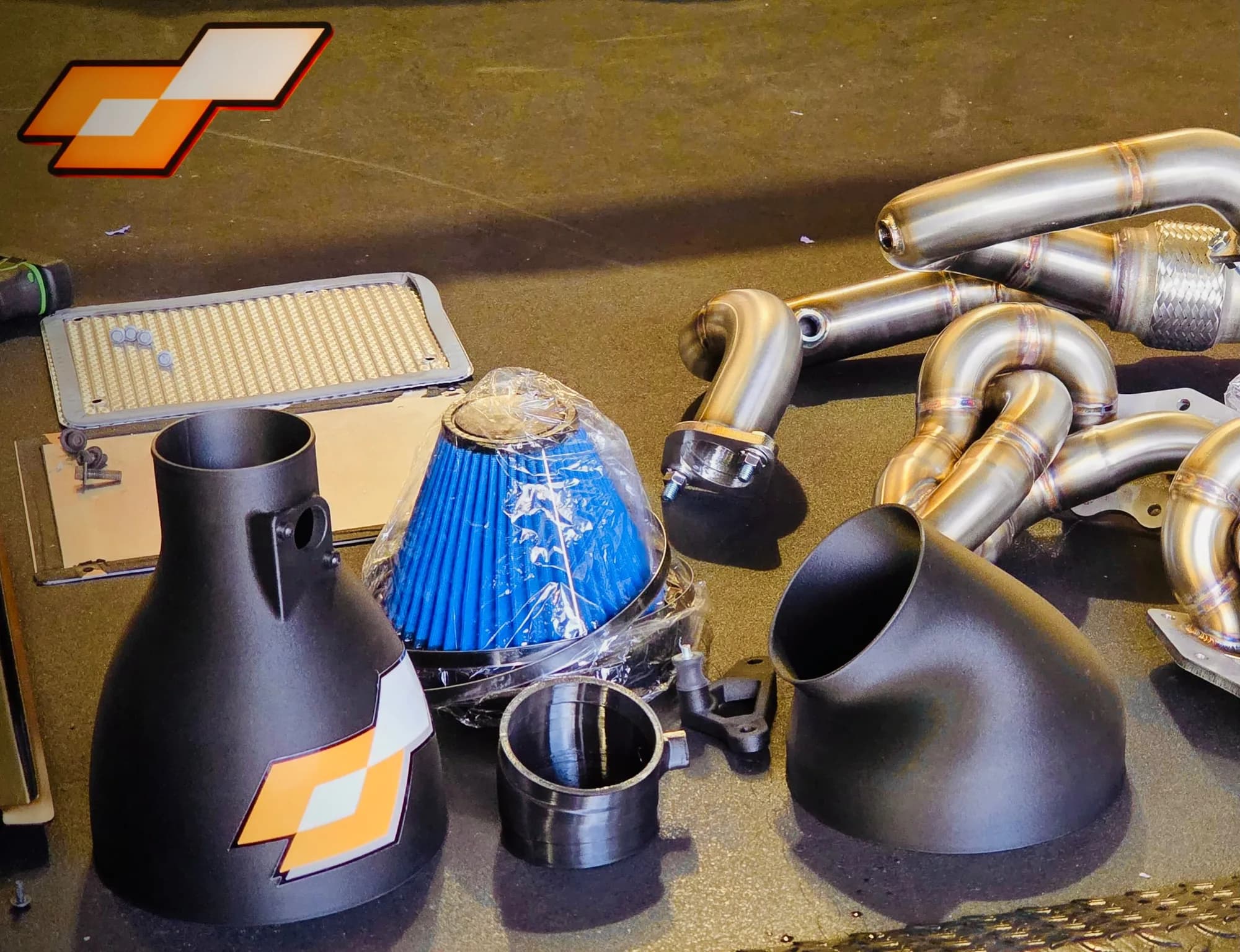 Evora 400 kit laid out: exhaust manifolds, induction parts and filter