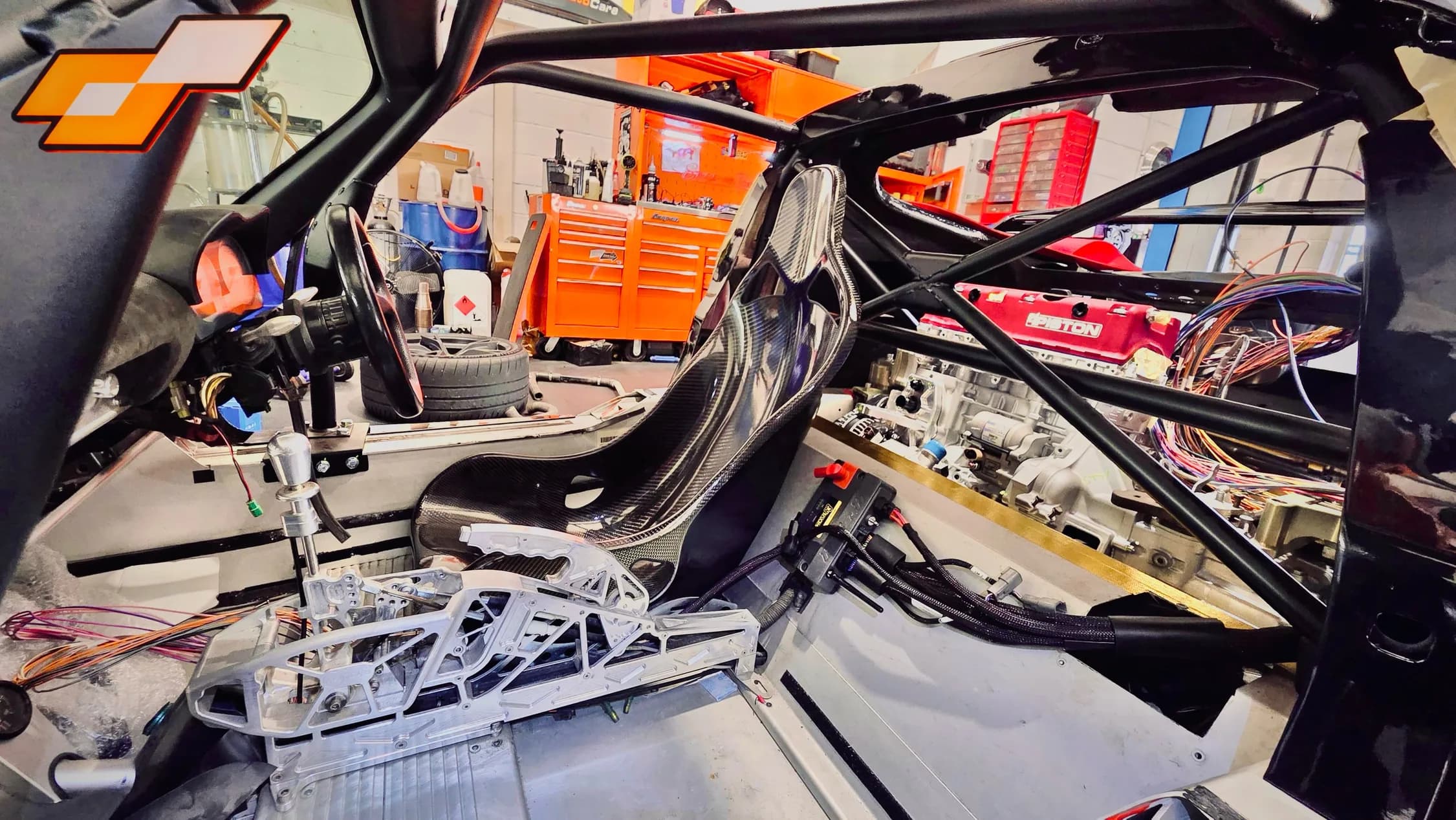 Elige K-swap cockpit with carbon fibre seat, roll cage and billet gear shifter