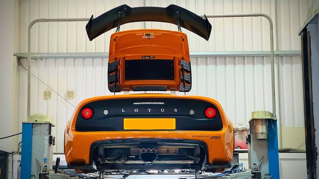 Orange Exige in Performance Autocare Workshop