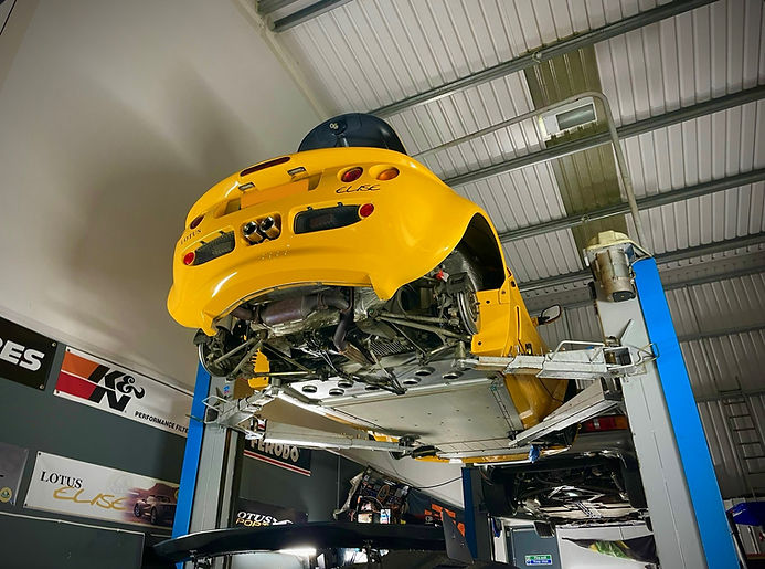 Yellow Elise in Performance Autocare Workshop